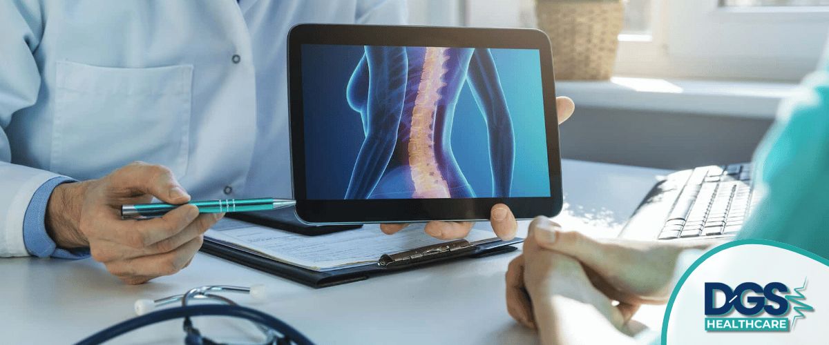 Doctor discussing spine health on tablet Orthopedic Surgery in Turkey